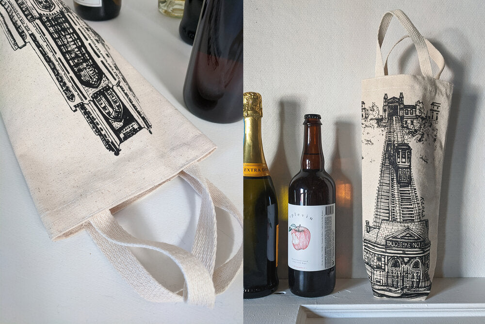 Wine bottles and raw canvas wine totes with Cathedral of Learning or Duquesne Incline drawings